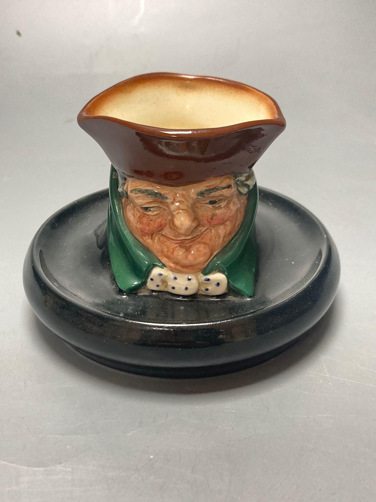A Royal Doulton Ugly Duchess character jug, Royal Doulton Tony Weller musical character jug and Royal Doulton Old Charley ashtray